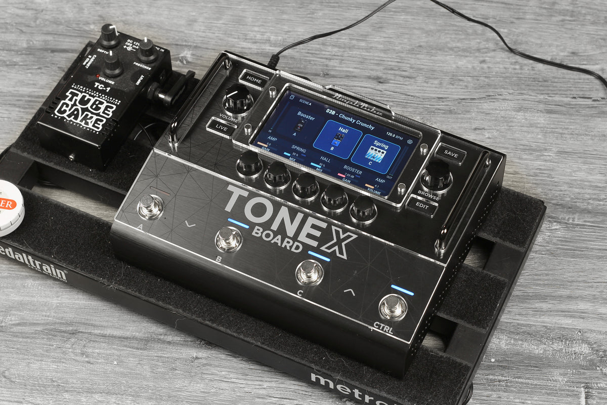 IK Multimedia TONEX Board on a pedalboard with the clear acrylic ProtectYourGear shield and the magnetic display cover fitted