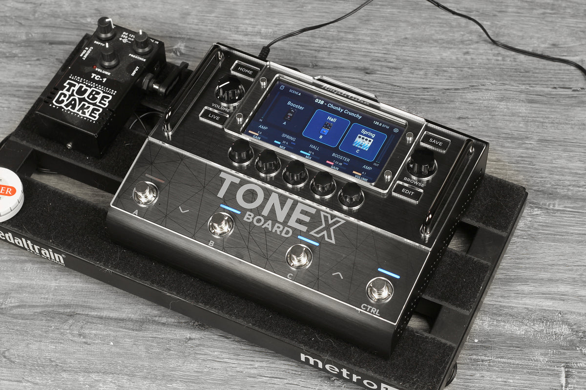 IK Multimedia TONEX Board with the clear acrylic shield on a pedalboard, front view