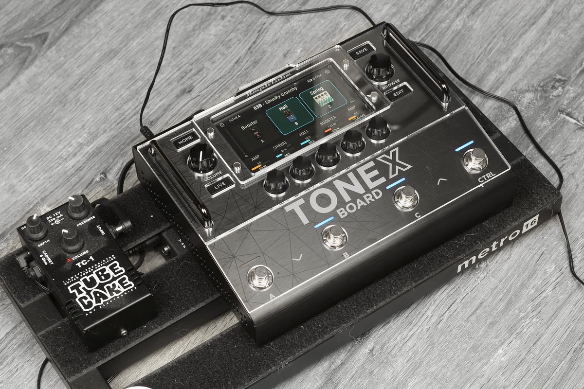 IK Multimedia TONEX Board seen from the side, with the acrylic shield over the display and the control knobs