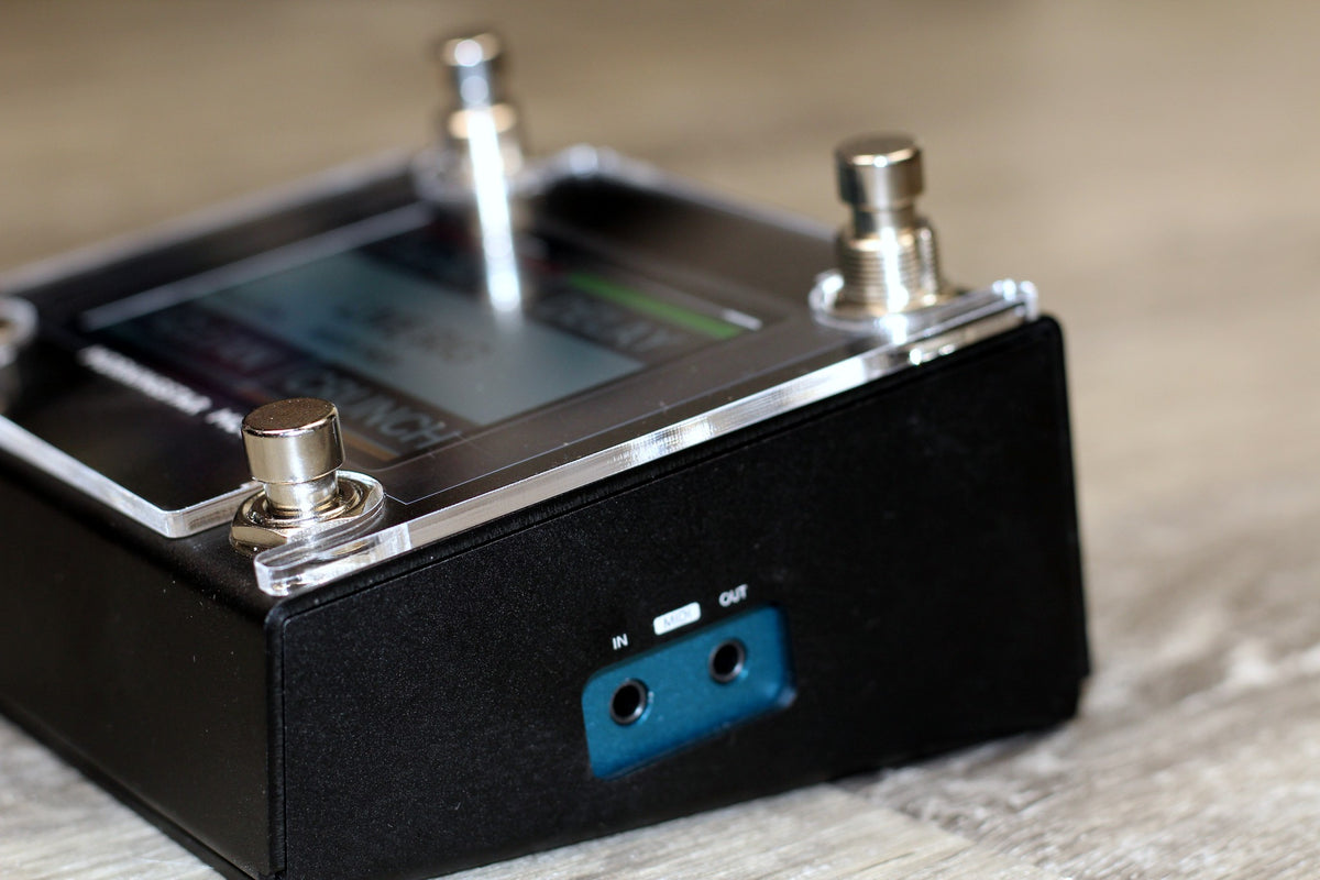 Morningstar MC4 Pro seen from the back with the MIDI jacks, clear acrylic shield on top