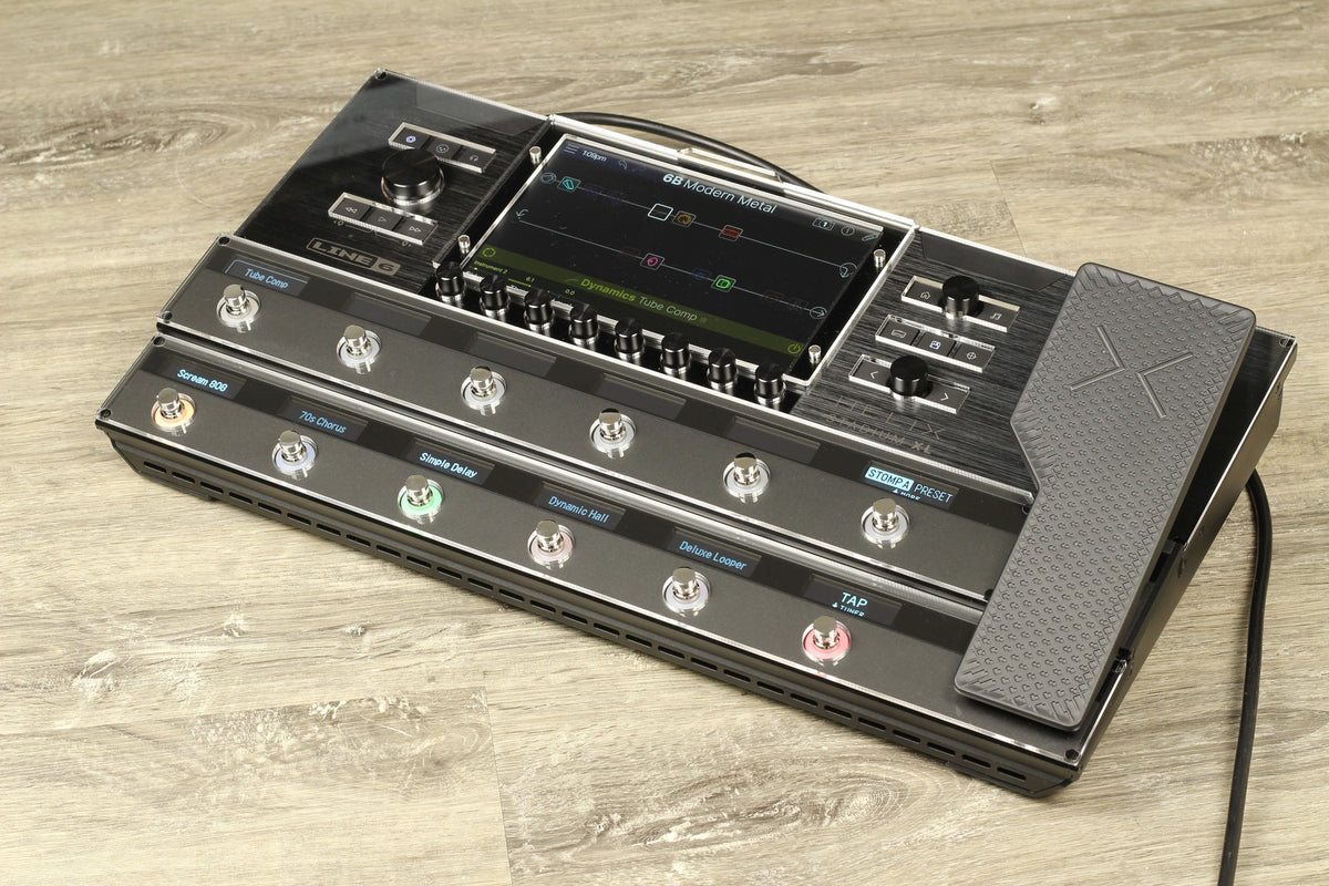 Line 6 Helix Stadium XL on a wooden floor with the clear acrylic ProtectYourGear shield fitted over the display and both footswitch rows