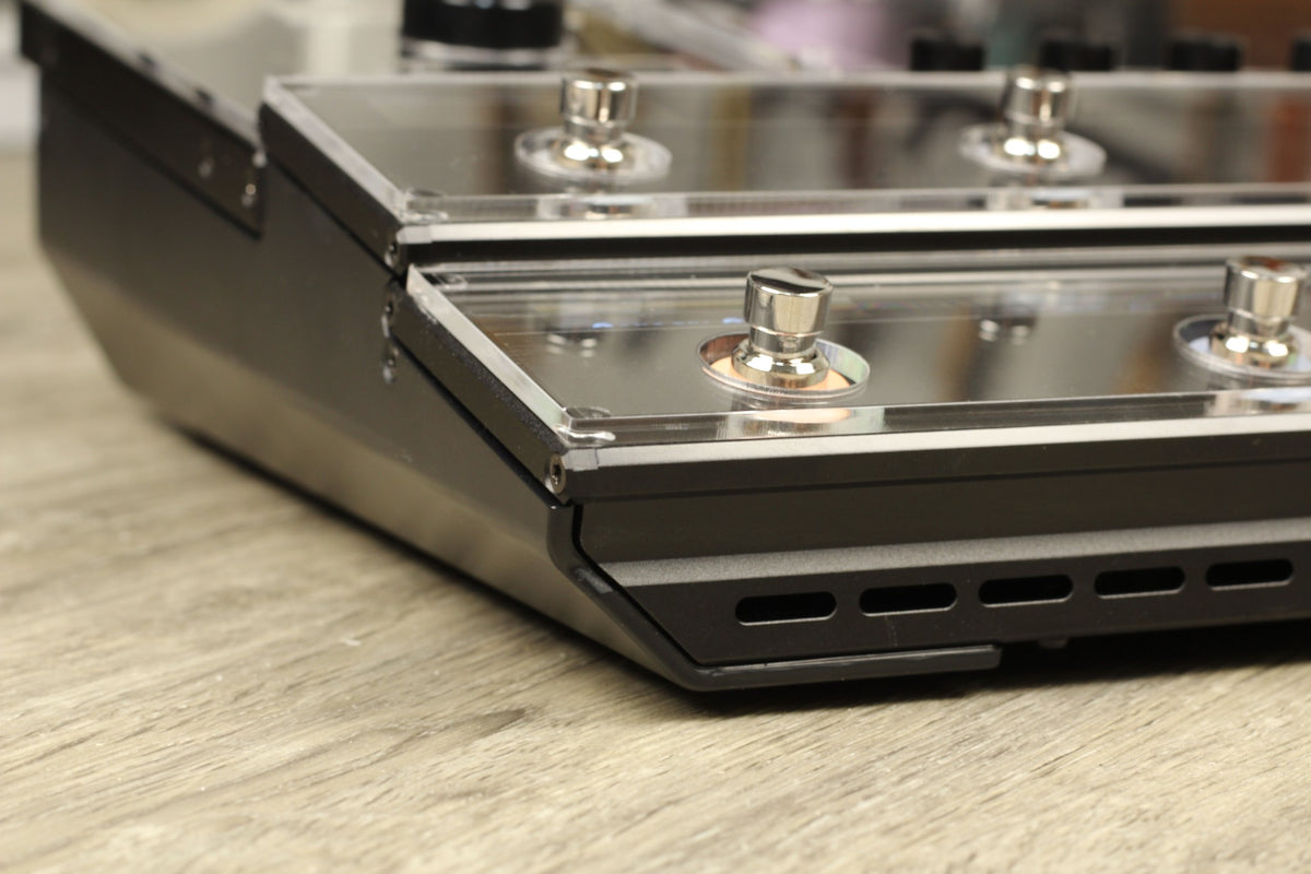 Side view of the laser-cut acrylic edge on the Line 6 Helix Stadium XL, with the footswitches passing through the cutouts