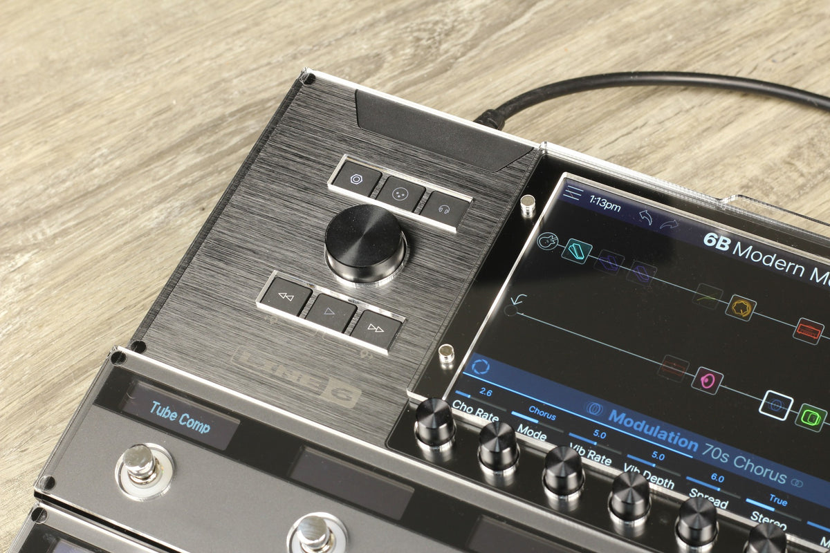 Close-up of the acrylic shield on the Line 6 Helix Stadium XL around the navigation knob, the buttons and the display