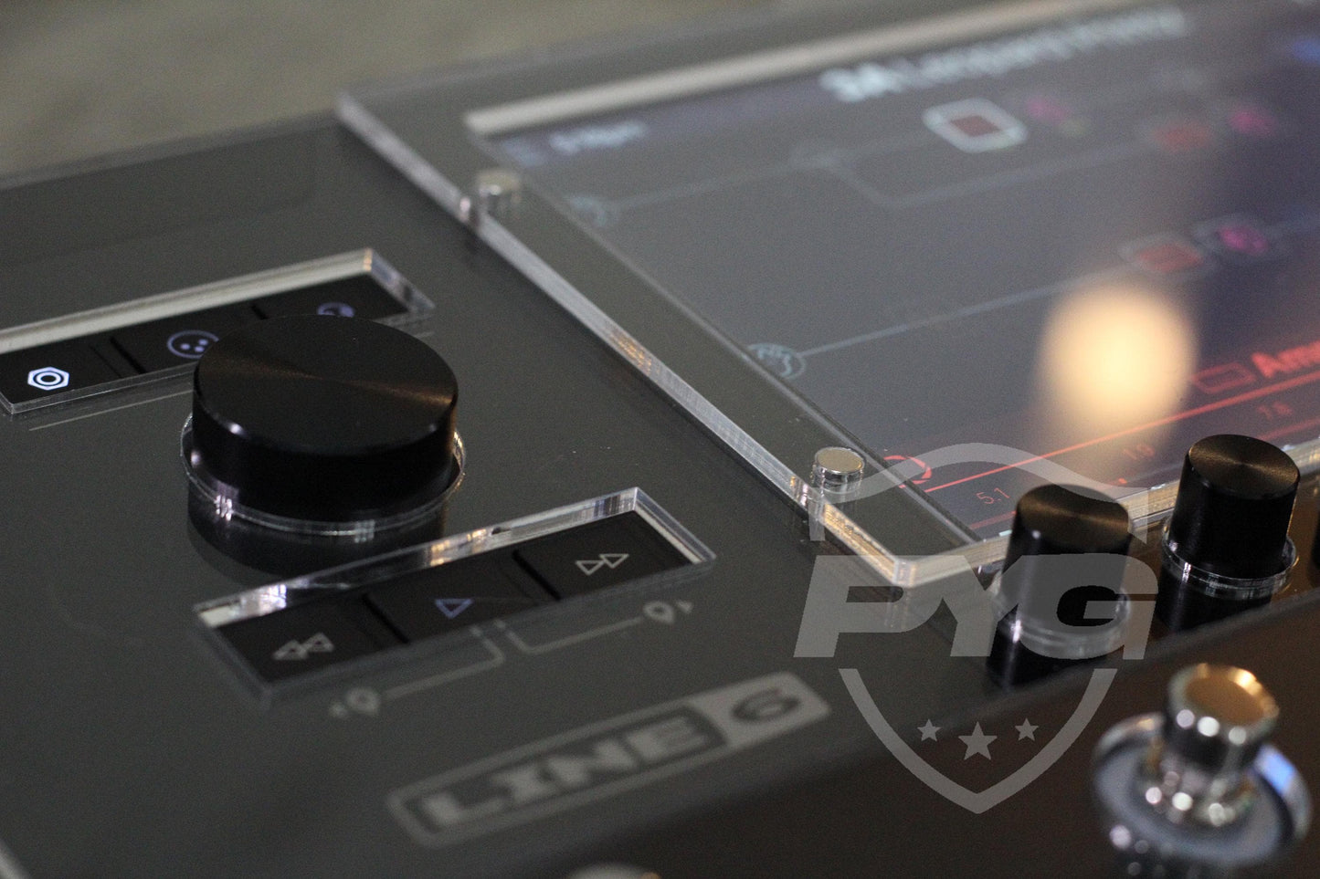 Close-up of the acrylic protector on the Line 6 Helix Stadium, with precise cutouts around the encoder knob, the buttons and the display