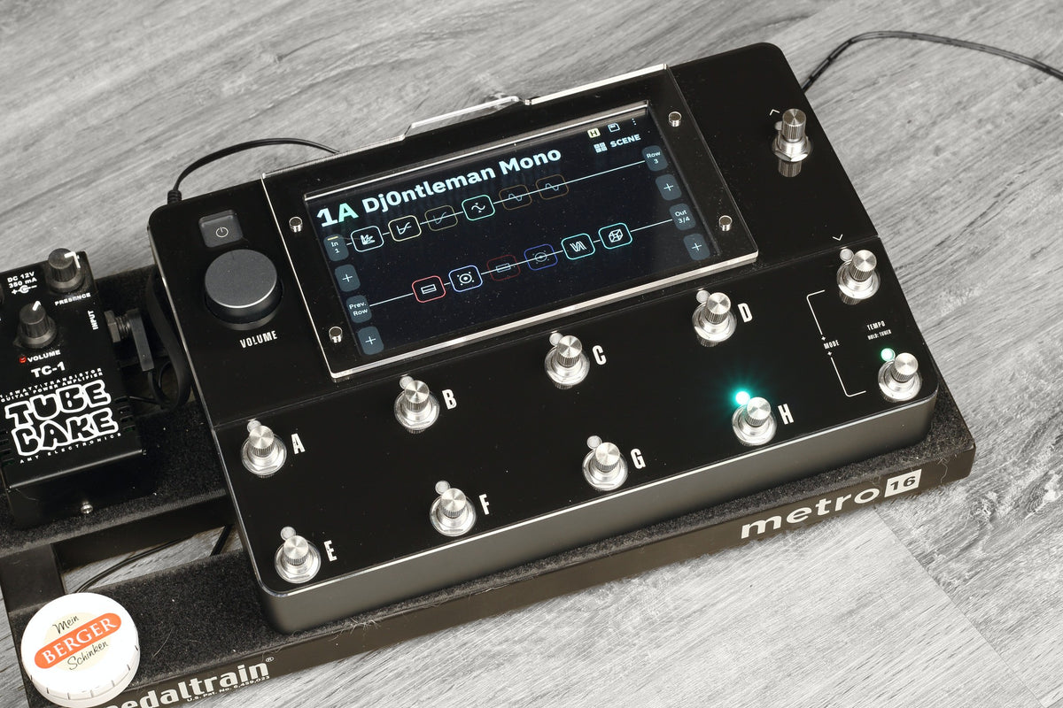 Neural DSP Quad Cortex with the black ProtectYourGear acrylic shield on a pedalboard, labels printed on, LED windows clear